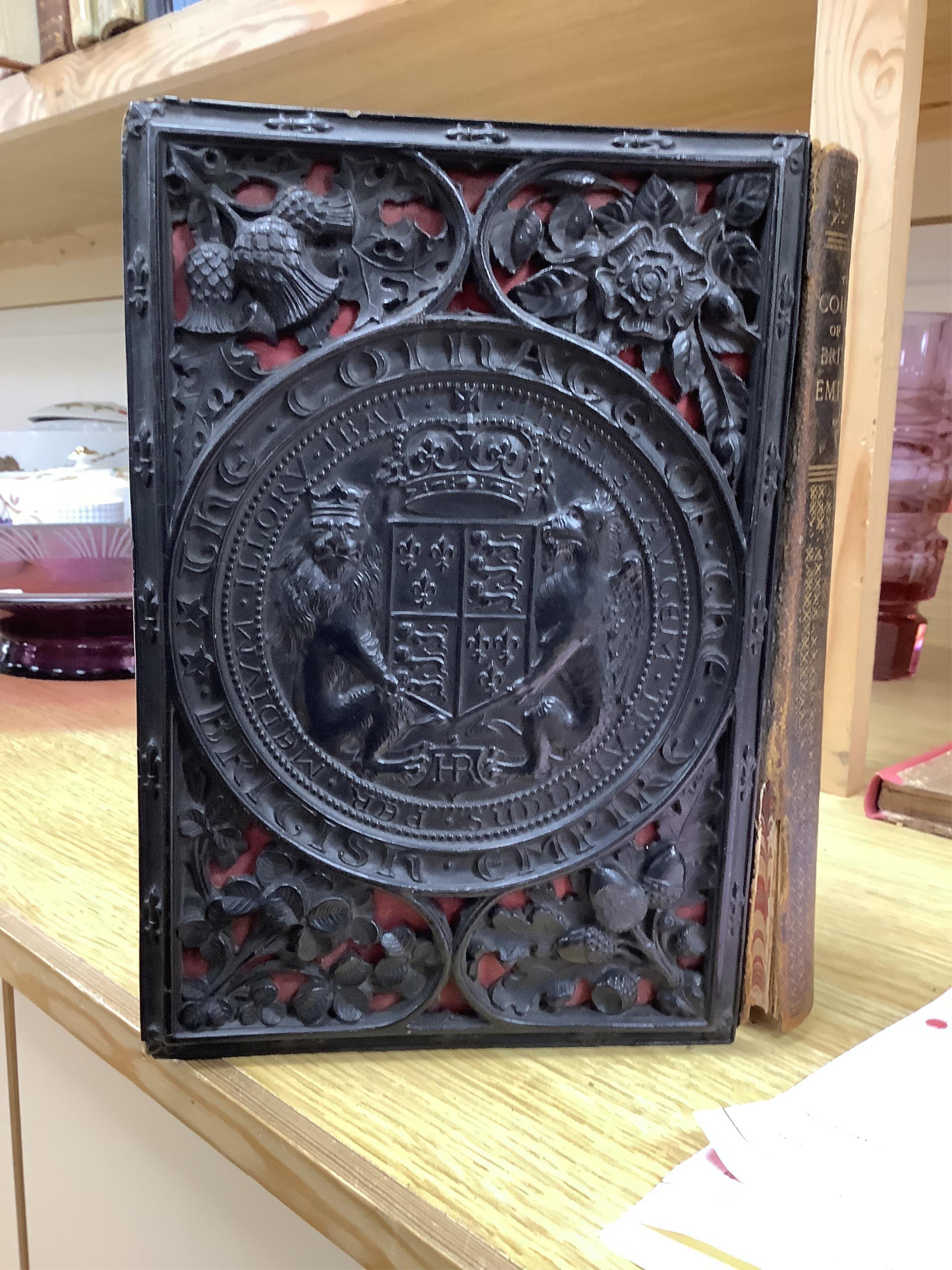 Humphreys, Henry Noel. The coinage of the British Empire. London, 1863. 8vo, 24 plates, papier maché binding with royal coat of arms in relief, original leather spine